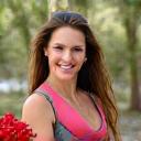 Portrait of Sara Jones, Bush Tucker Specialist, holding native Australian fruits.